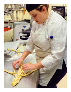 student learning to braid bread