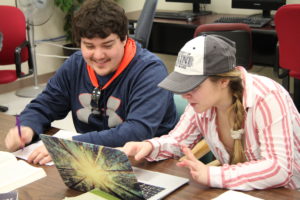 two students working in writing center