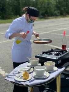 culinary arts student coking outside