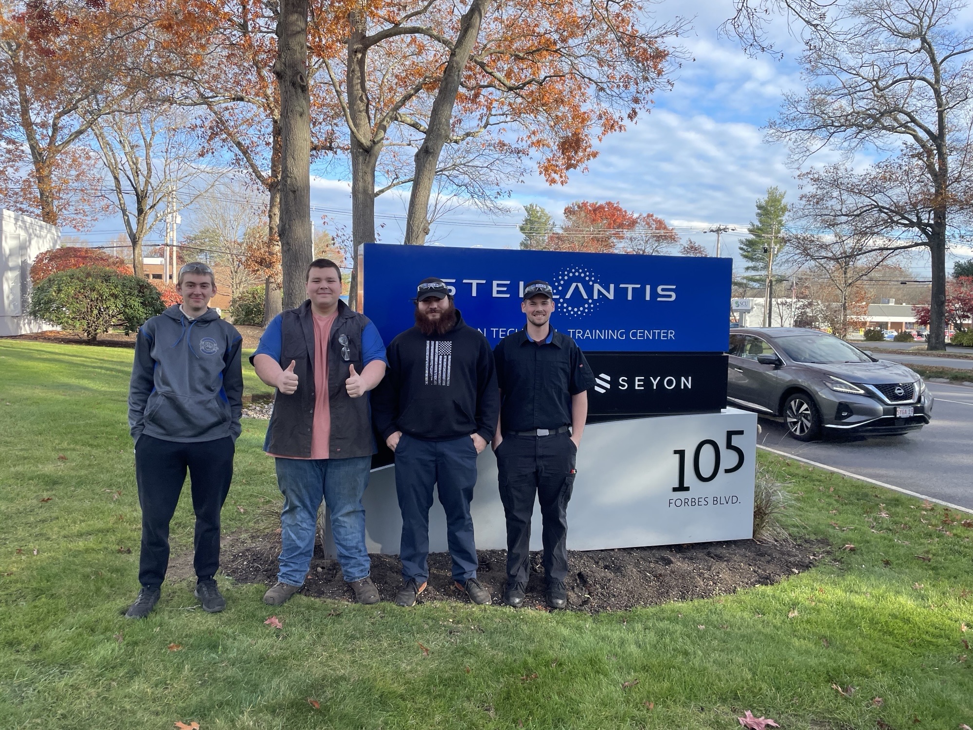 Eastern Maine Community College automotive students, from left, Daniel Tomoiu, Nathaniel Kirkendall, Haris Plavsic and Gavin McDonough, stand outside the Stellantis Technical Training Center in Mansfield, Massachusetts, where they completed the hands-on challenge that advanced EMCC to the final round of the 2025 Mopar CAP Bracket Challenge.